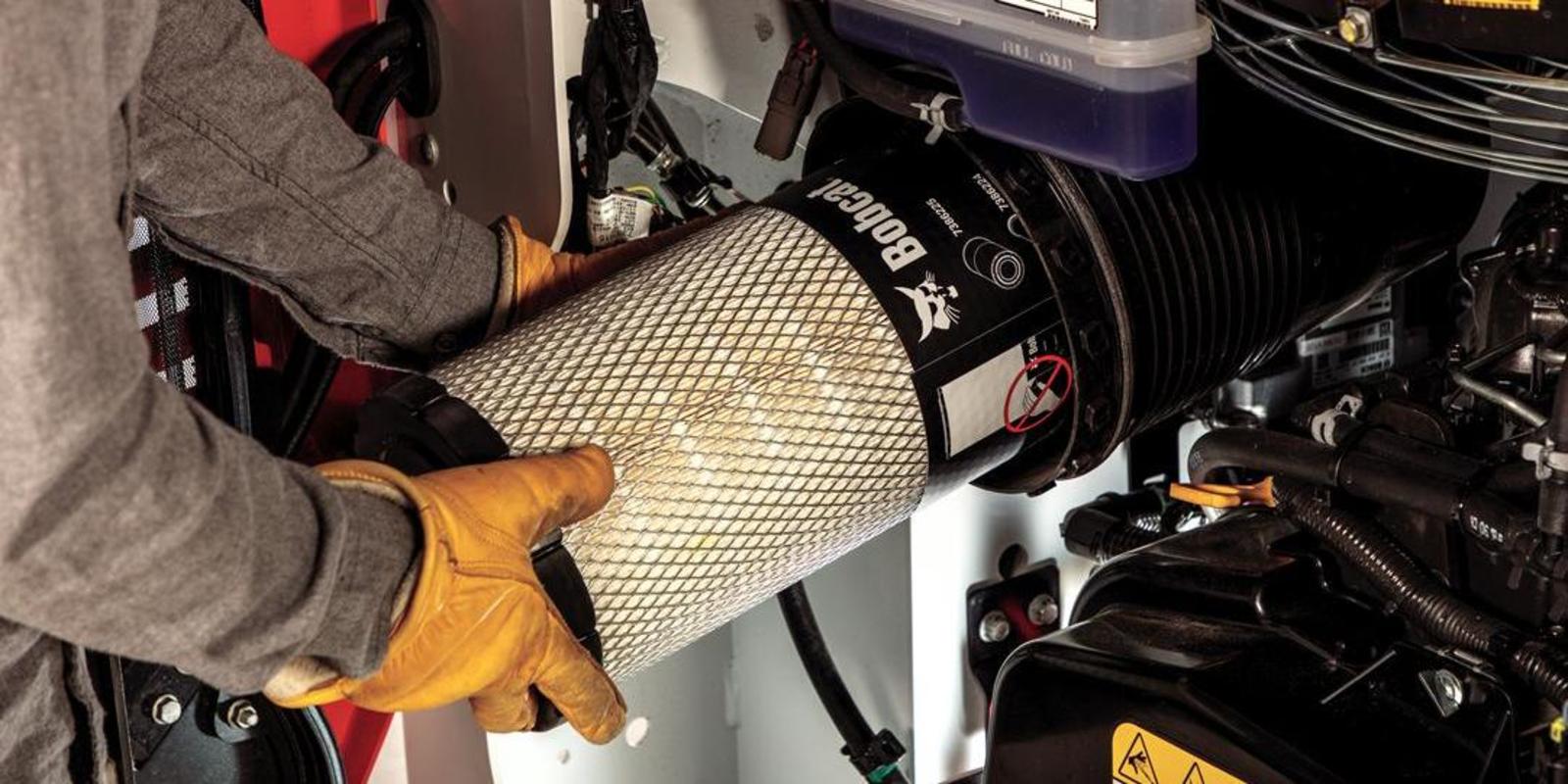 If your Bobcat compact loader has been working hard in increasingly warm weather, do not open the air cleaner to take a quick look at the filters.